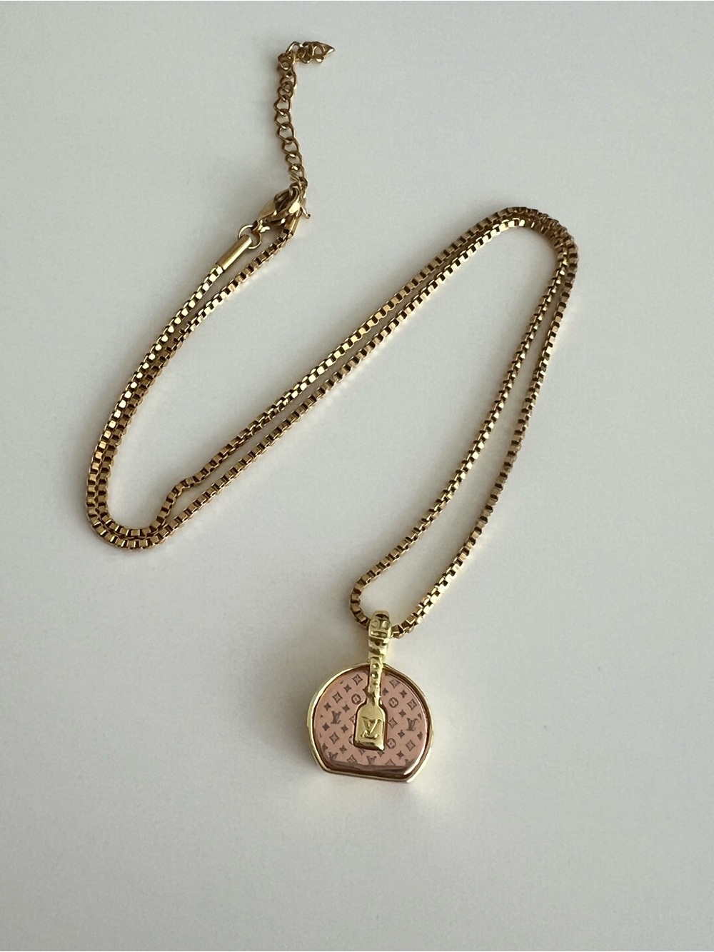 Gold plated box chain with LV charm